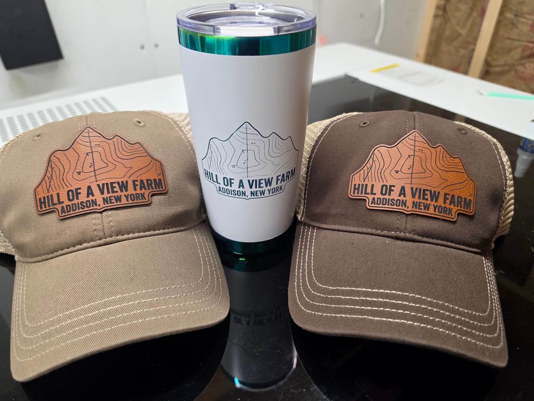 Leather patch hats and tumbler for Hill of a View Farm